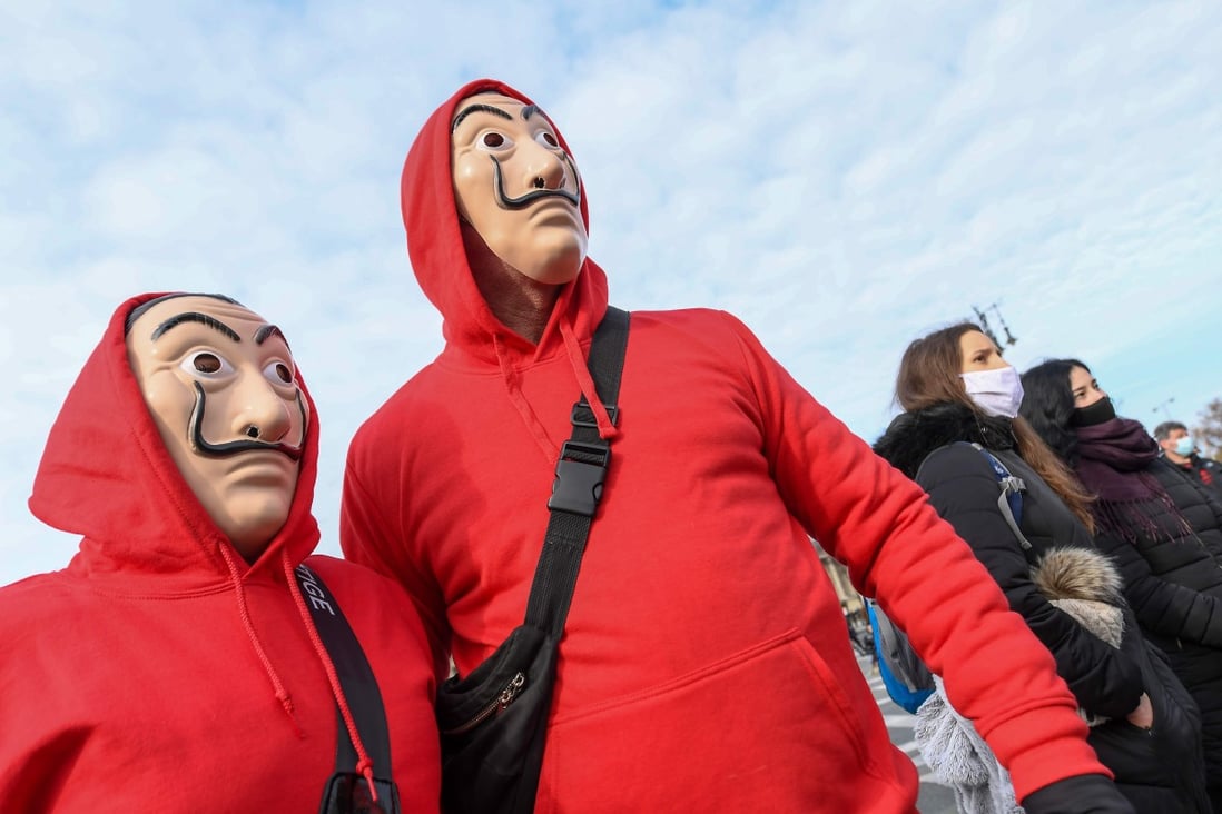 Protesters wear Guy Fawkes masks during an anti-lockdown demonstration organised by the hospitality sector, at the Heroes square in Budapest, Hungary, on January 31. Photo: AFP