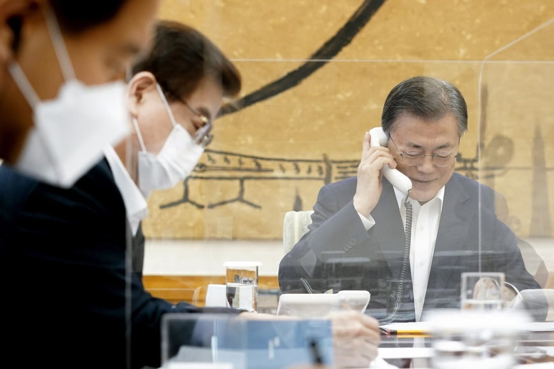South Korean President Moon Jae-in (right) talks with his US counterpart Joe Biden over the phone. The two leaders agreed to upgrade the bilateral alliance. Photo: YNA/DPA