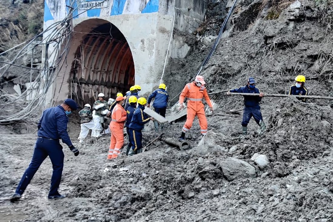 Rescuers remove debris cause by floodwaters at a hydropower project in the Chamoli district of India’s Uttrakhund state on Monday. Photo: National Disaster Response Force via AP