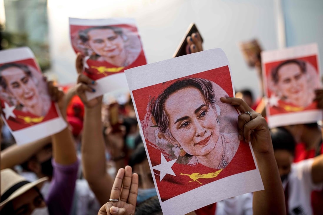 Protester hold images of detained Myanmar civilian leader Aung San Suu Kyi during a demonstration against the military coup outside the Myanmar Embassy in Bangkok on Sunday. Photo: AFP