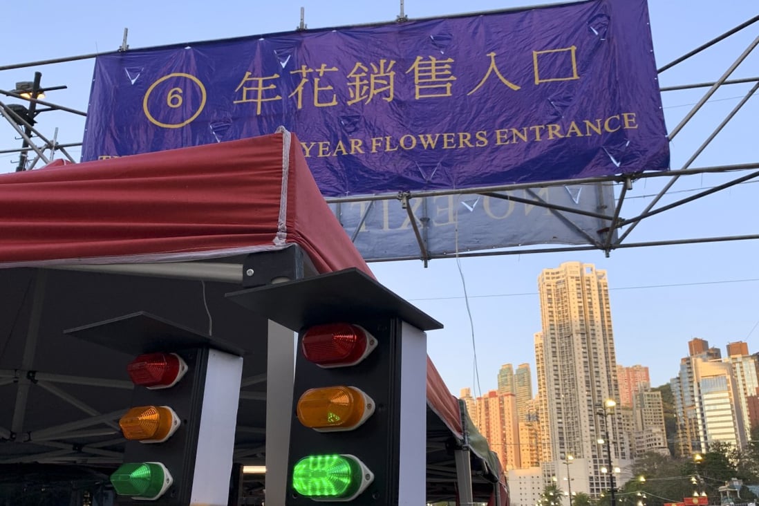 An alert system based on traffic lights to indicate crowd size at a flower market in Victoria Park, Causeway Bay. Photo: Warton Li