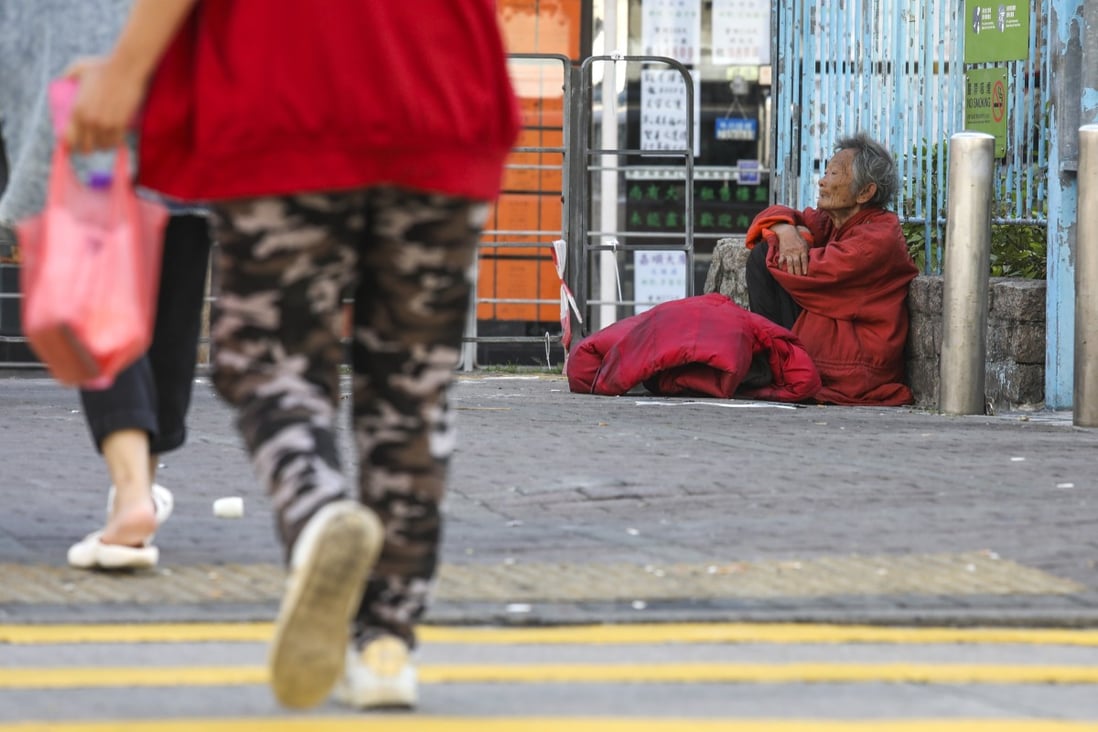 An elderly woman rests on the pavement in Sham Shui Po in January 2020. Photo: Nora Tam
