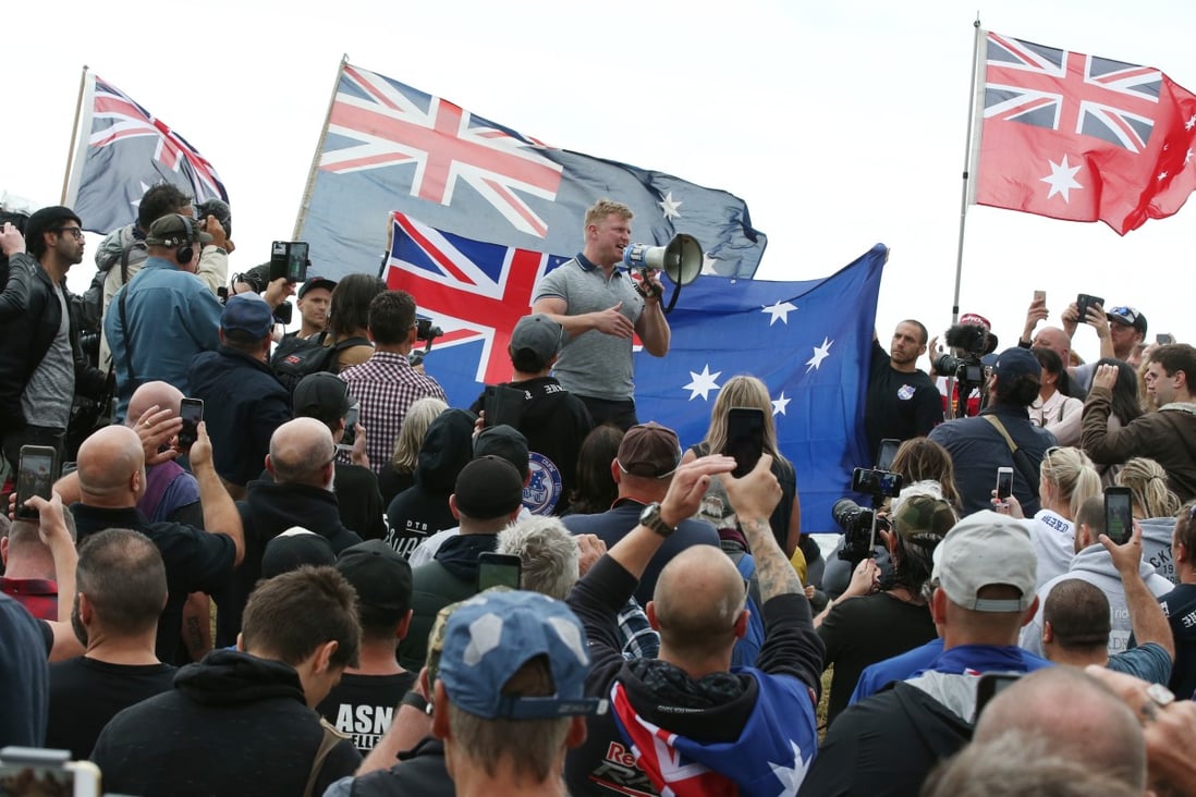 Australian far-right extremist Blair Cottrell talks to supporters at a nationalist rally in Melbourne in January 2019. Photo: EPA