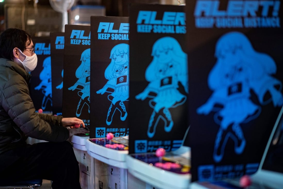 A man plays a game at the Mikado game centre in the Shinjuku district of Tokyo last month. Bright, noisy arcades are still a neighbourhood fixture in Japan, but have been disappearing as business is hit by virus-curtailed opening hours. Photo: AFP
