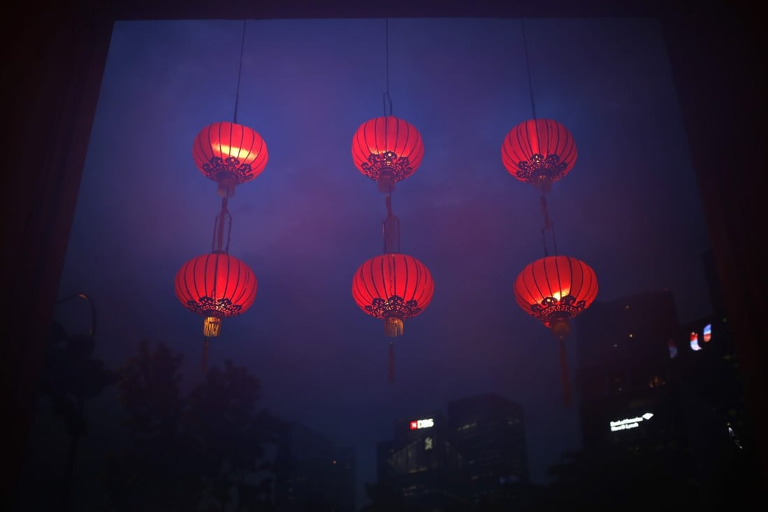 Chinese lanterns hang in a doorway in downtown Singapore. Photo: EPA