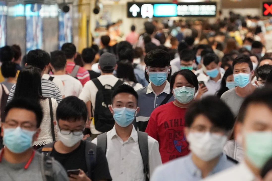 Morning commuters change platforms on the East Rail Line on July 14, 2020, as Hong Kong battled its third wave of coronavirus infections. New nine-car trains were introduced on the line on February 6, 2021, amid the city’s fourth wave of Covid-19. Photo: Felix Wong