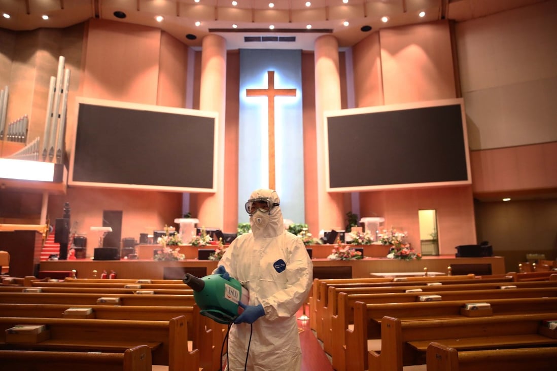 A disinfection worker at the Yoido Full Gospel Church in South Korea amid concerns over the spread of the coronavirus. Photo: Getty Images