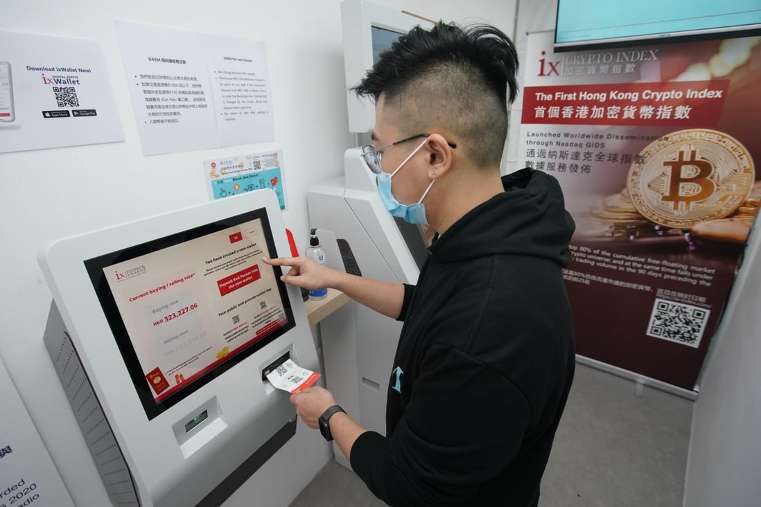 Hugo Zheng, manager of ixFintech, shows how to use a pre-provided paper wallet and QR code to buy bitcoin at a shop in Kennedy Town on February 8. Photo: Felix Wong