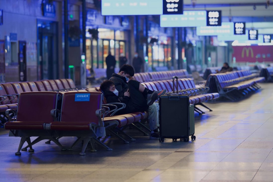 Passengers wait for their train at a Beijing railway station on Thursday, ahead of the biggest holiday of the year. Photo: AFP