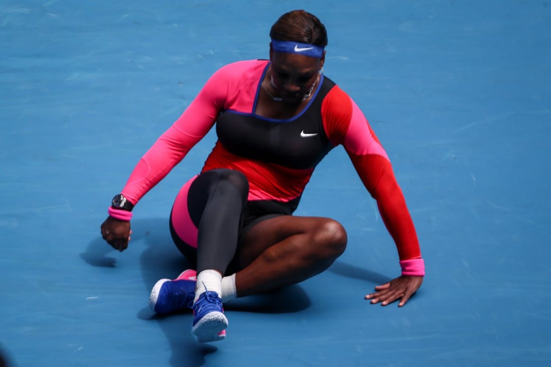 Serena Williams is on the floor during her match against Belarus’ Aryna Sabalenka at the Australian Open. Photo: EPA
