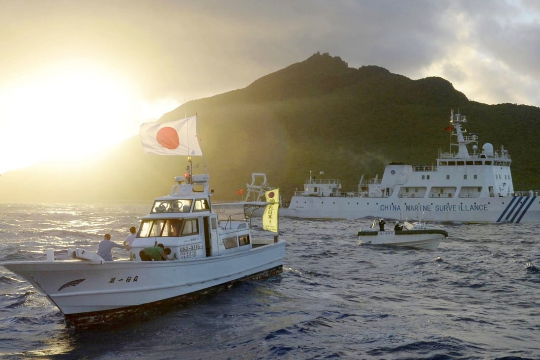 A Chinese maritime surveillance vessel (right) passes near the Senkaku Islands in the East China Sea in 2013. Photo: Kyodo
