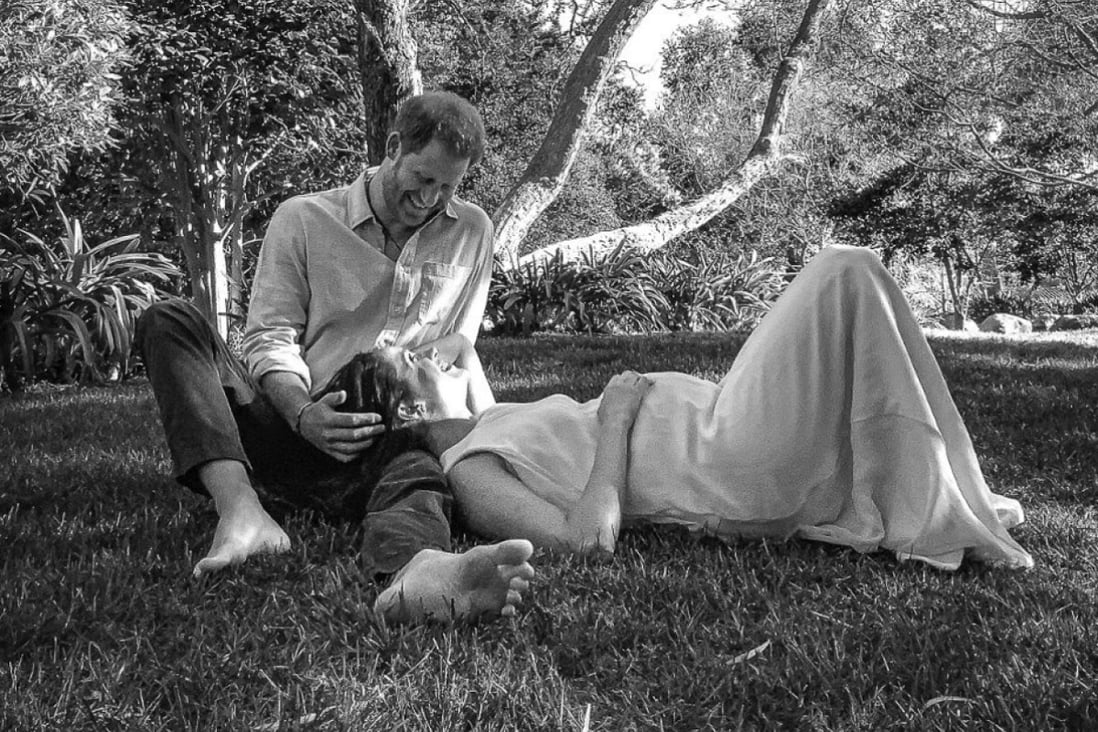 The couple shared a black and white photo of themselves under a tree, with Meghan Markle resting her head on Prince Harry’s leg while holding her tummy. Photo: Reuters