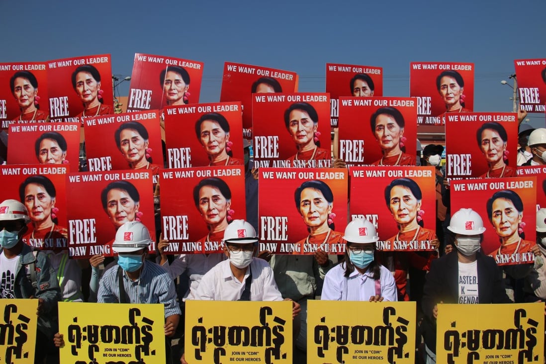 Demonstrators hold up placards calling for the release of State Counsellor Aung San Suu Kyi during a February 15 protest in Naypyidaw against the military coup. Photo: EPA