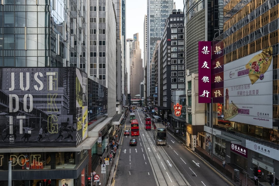 Vehicles travel along Des Voeux Road Central on October 5, 2019, when the city went into near shutdown as businesses closed and rail services were suspended for the first time in more than 20 years after overnight violence during anti-government protests. Hong Kong’s economy has been hit hard by the double whammy of the coronavirus pandemic and the protests. Photo: Bloomberg