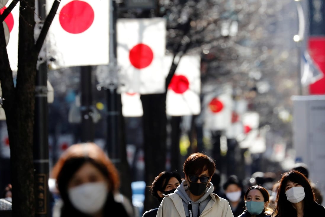 Pedestrians make their way through the Ginza shopping district in Tokyo. In contrast to the West, inflation expectations in Japan remain stubbornly subdued despite the Bank of Japan’s accommodative monetary policy. Photo: Reuters