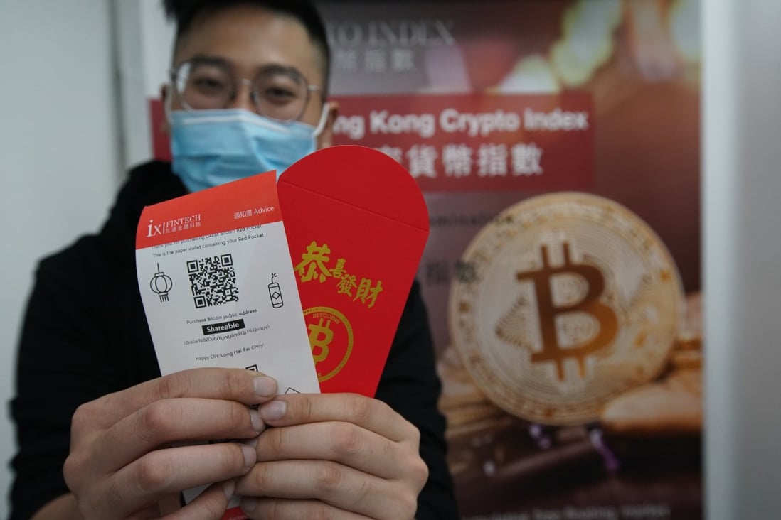 Hugo Zheng, Manager of ixfintech demonstrates how to use a pre-provided paper wallet + QR code to buy bitcoin for giving away as laisee, or hongbao on 8 February 2021. Photo: Felix Wong