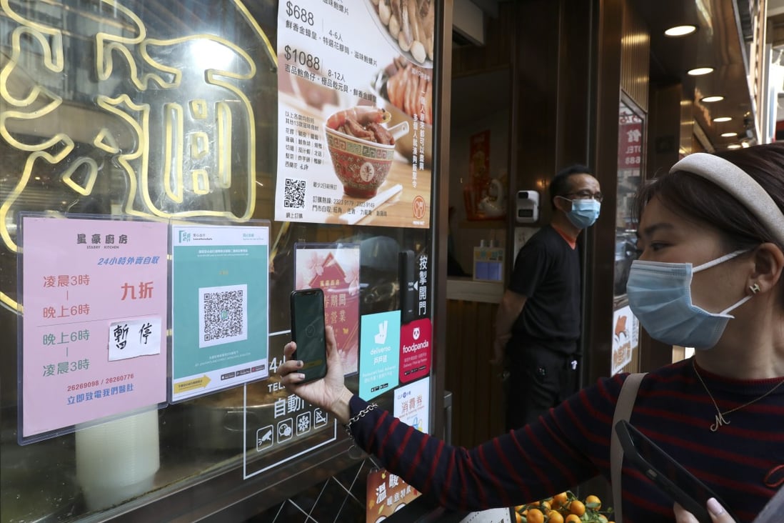 Tens of thousands of outlets in Hong Kong now display a QR code for the app. Photo: Nora Tam
