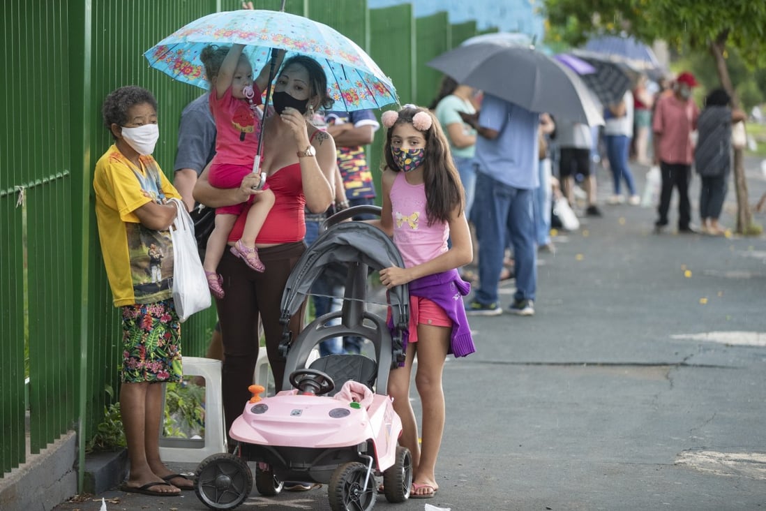 People wait in line to get a shot of the CoronaVac vaccine from China’s Sinovac in Serrana, Brazil on Wednesday. Photo: AP