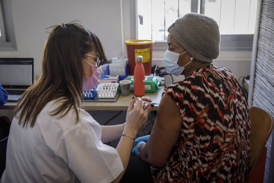 A woman receives a dose of the Pfizer Covid-19 vaccine in Tel Aviv, Israel. Photo: Bloomberg