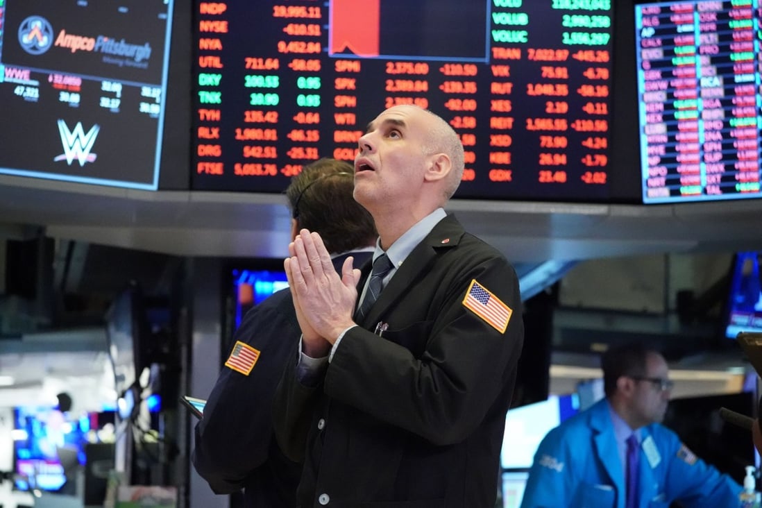 Traders at the New York Stock Exchange on March 18, 2020. US companies’ earnings are beating expectations, alleviating some of the concerns around elevated metrics such as forward price-to-earnings ratios. Photo: AFP