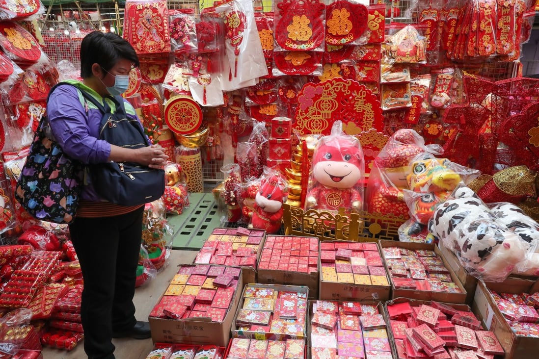 Lunar New Year decorations and lai see red packets are displayed for sale in Sham Shui Po on January 15. The HKMA should work with banks to facilitate the electronic transfer of lai see money. Photo: Edmond So