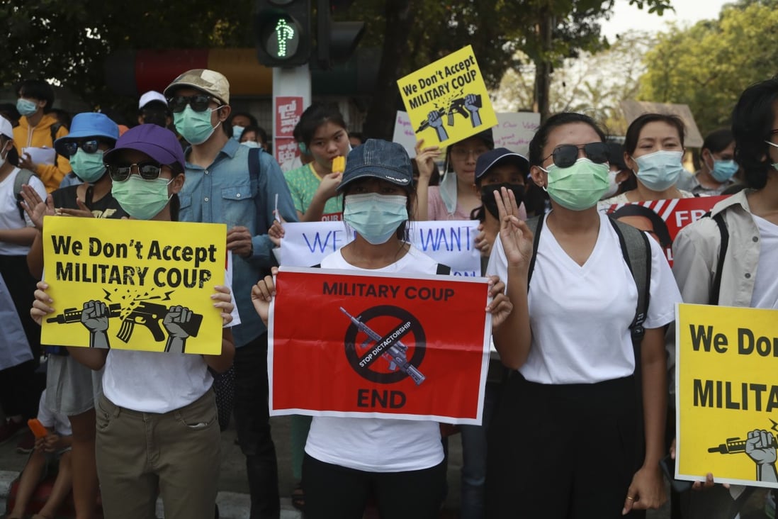 Demonstrators display placards during a protest near the Indonesian embassy in Yangon, Myanmar, on Tuesday. Photo: AP