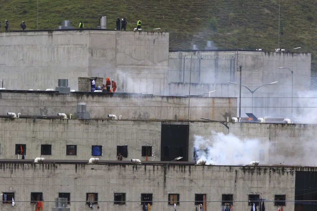 Tear gas rises from parts of Turi jail where an inmate riot broke out in Cuenca, Ecuador on Tuesday. Photo: AP