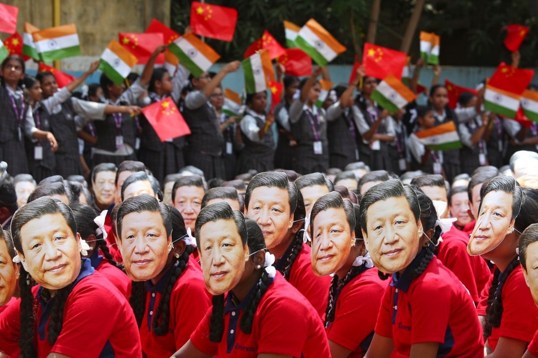Indian students in Chennai wearing masks of President Xi Jinping of China as others wave national flags of India and China, ahead of Xi’s informal summit with Indian Prime Minister Narendra Modi in October 2019. Photo: Reuters