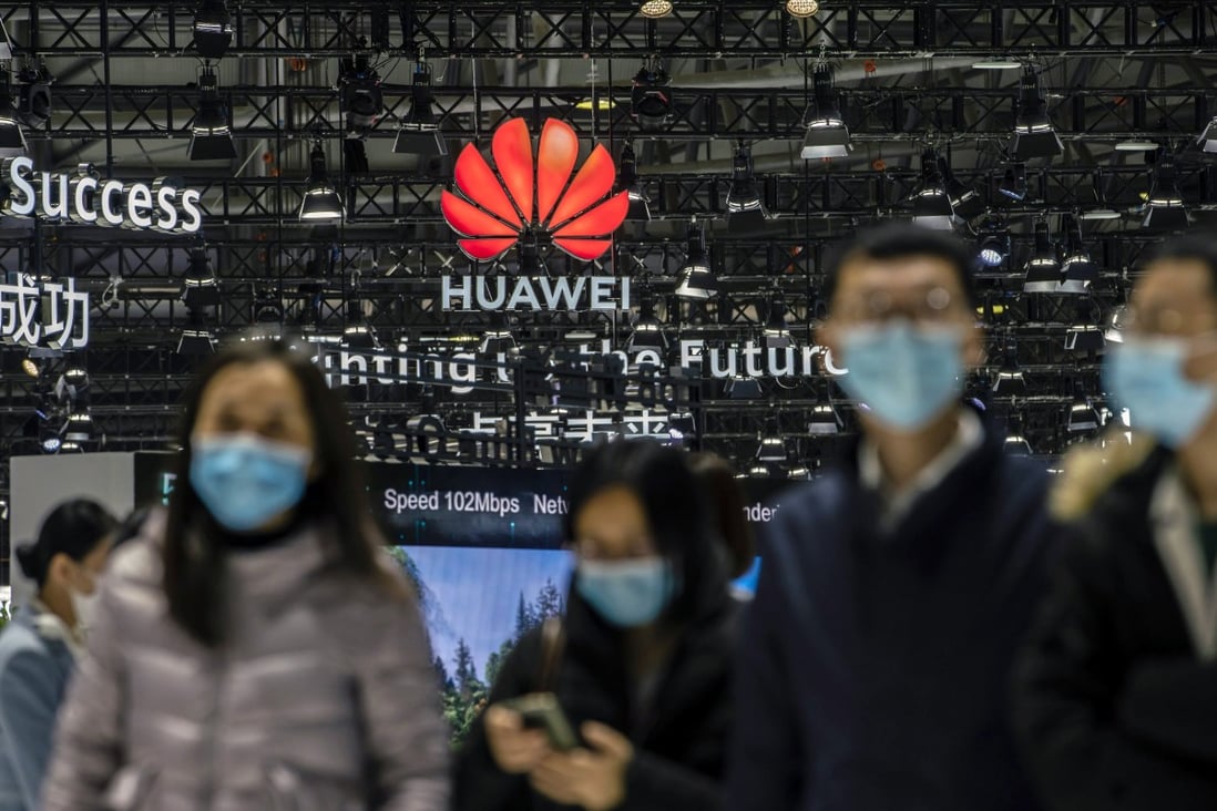 Attendees walk past the Huawei Technologies logo at the MWC Shanghai exhibition in Shanghai on Tuesday, Feb. 23, 2021. Photo: Bloomberg