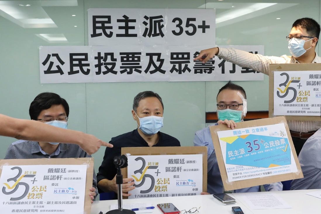 Former lawmaker Au Nok-hin (left), Benny Tai, Power for Democracy convenor Andrew Chiu, and Sai Kung district council chairman Chung Kam-lun, raise awareness for the primary elections last July. Photo: Nora Tam
