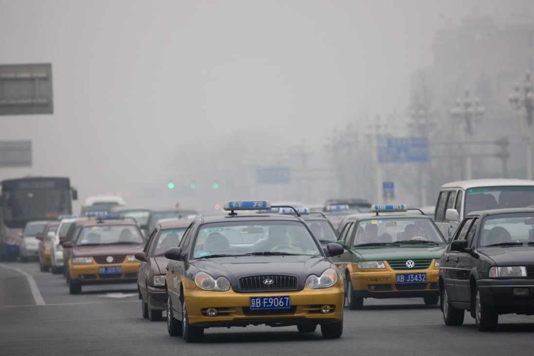 Taxis and traffic in a Beijing main street. China is the world’s biggest emitter of carbon dioxide, generating more than the US and Europe combined. Photo: Getty Images