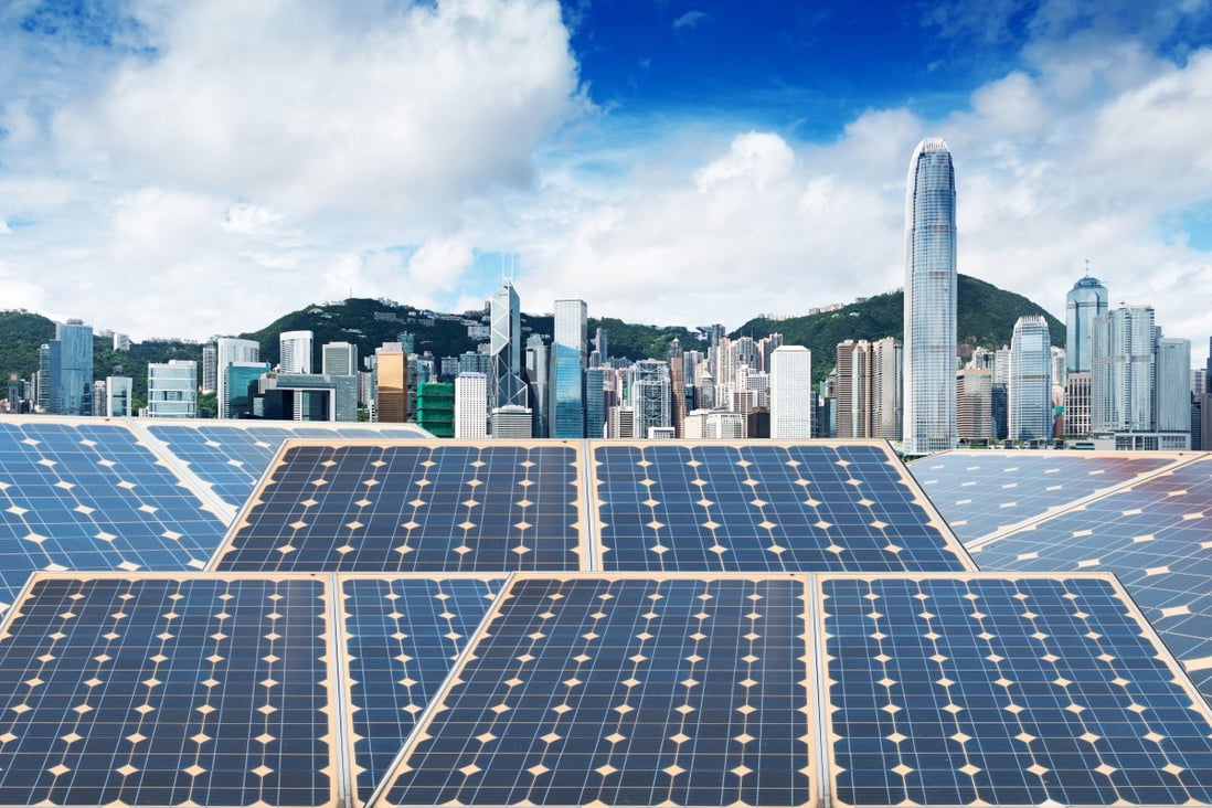 Solar panels and the Hong Kong skyline. Photo: Shutterstock