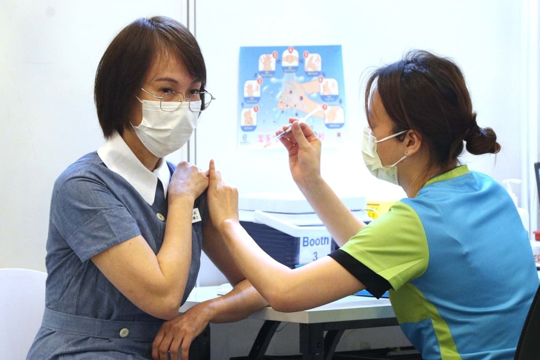 A nurse receives Covid-19 vaccinations at the Community Vaccination Centre at the Hong Kong Central Library in Causeway Bay. Photo: Pool from Ming Pao
