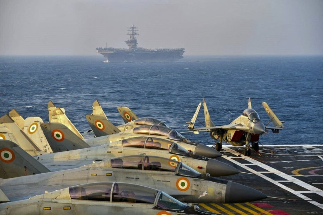 Indian fighter jets on the deck on an aircraft carrier during the Malabar naval exercise, which includes forces from Australia, Japan and the United States. Photo: AFP