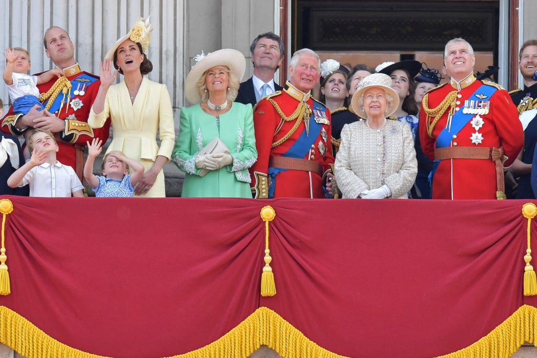Britain’s Queen Elizabeth, flanked by her sons Prince Charles and Prince Andrew, pictured alongside other members of the UK royal family standing on a balcony at Buckingham Palace to watch a fly-past in 2019. Photo: AFP