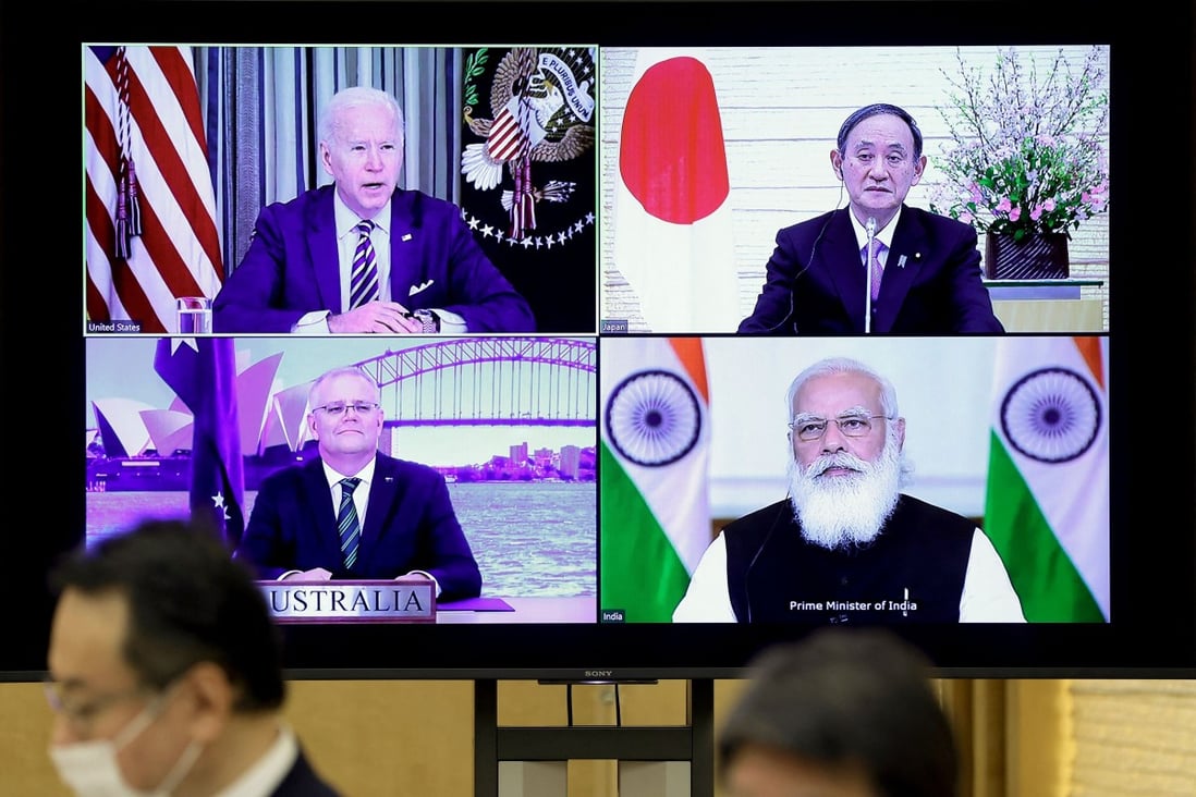 A monitor in Tokyo displays the virtual “Quad” meeting on Friday of (clockwise from top left) US President Joe Biden, Japan’s Prime Minister Yoshihide Suga, India‘s Prime Minister Narendra Modi and Australia's Prime Minister Scott Morrison. Photo: AFP