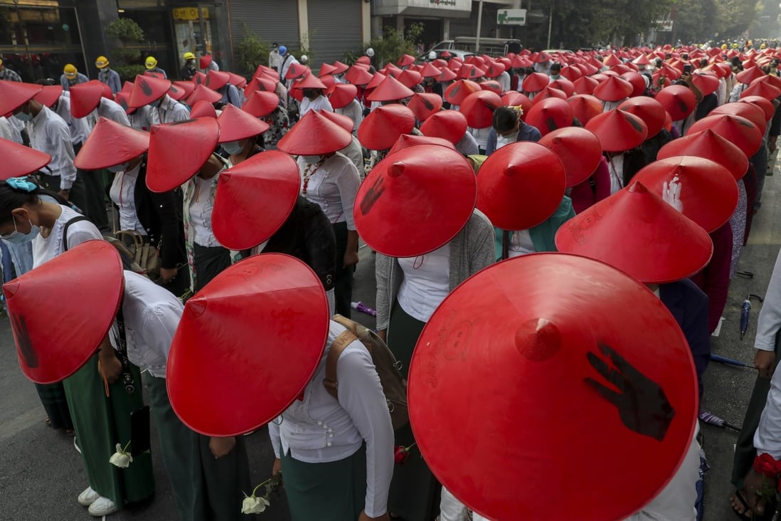 Anti-coup school teachers in their uniform and traditional hats at a protest in Mandalay, Myanmar. Photo: AP