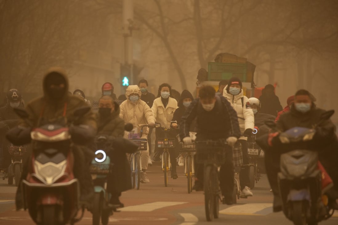 A sandstorm in a Beijing intersection is evidence of the difficulty in curbing the spread of deserts. Photo: AP