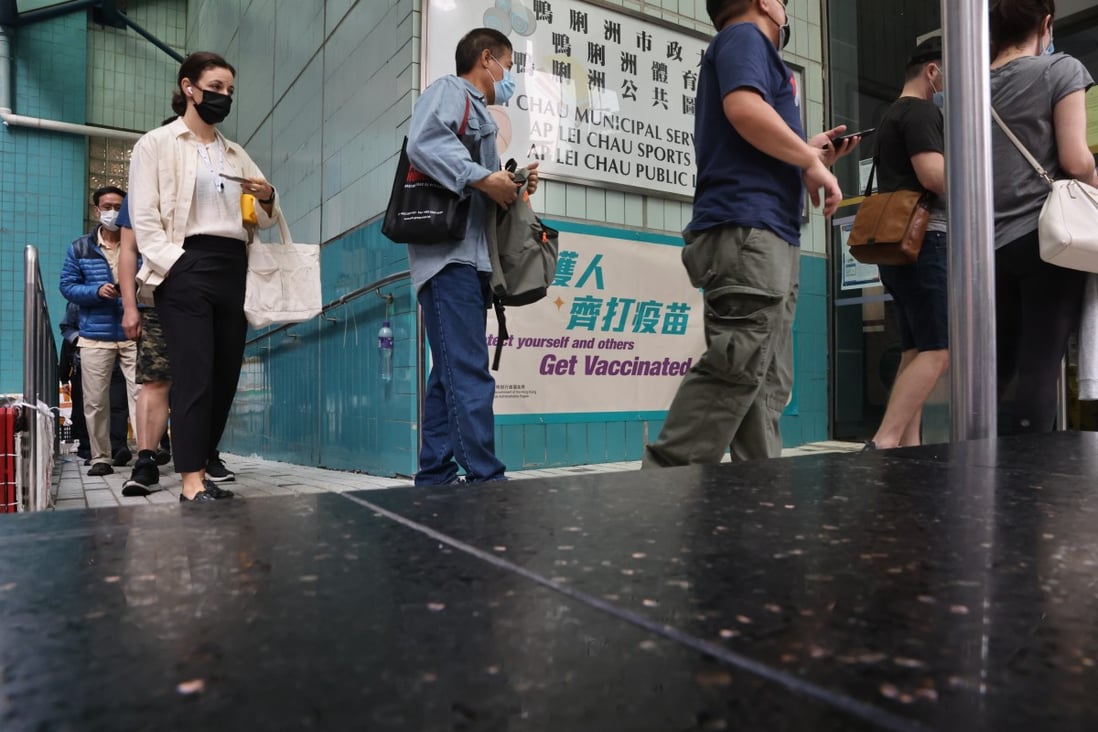 Members of the public queue for a BioNTech jab at the Ap Lei Chau Sports Centre. Photo: K. Y. Cheng