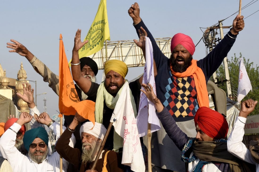 Indian farmers shout slogans as they take part in a demonstration and move towards New Delhi to join the protest against Prime Minister Narendra Modi’s recent agricultural reforms. Photo: AFP