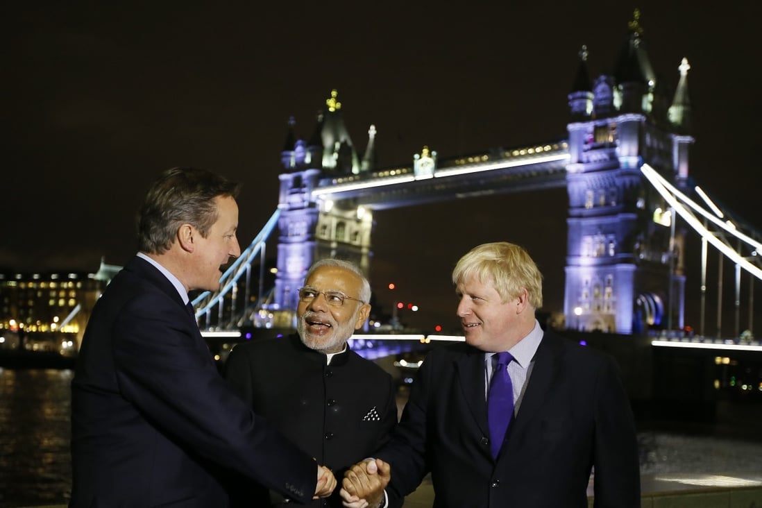 Indian Prime Minister Narendra Modi, centre, during his 2015 visit to Britain, where he met Boris Johnson, right, who was then the mayor of London. Johnson will now visit India as the British prime minister next month. Photo: AP
