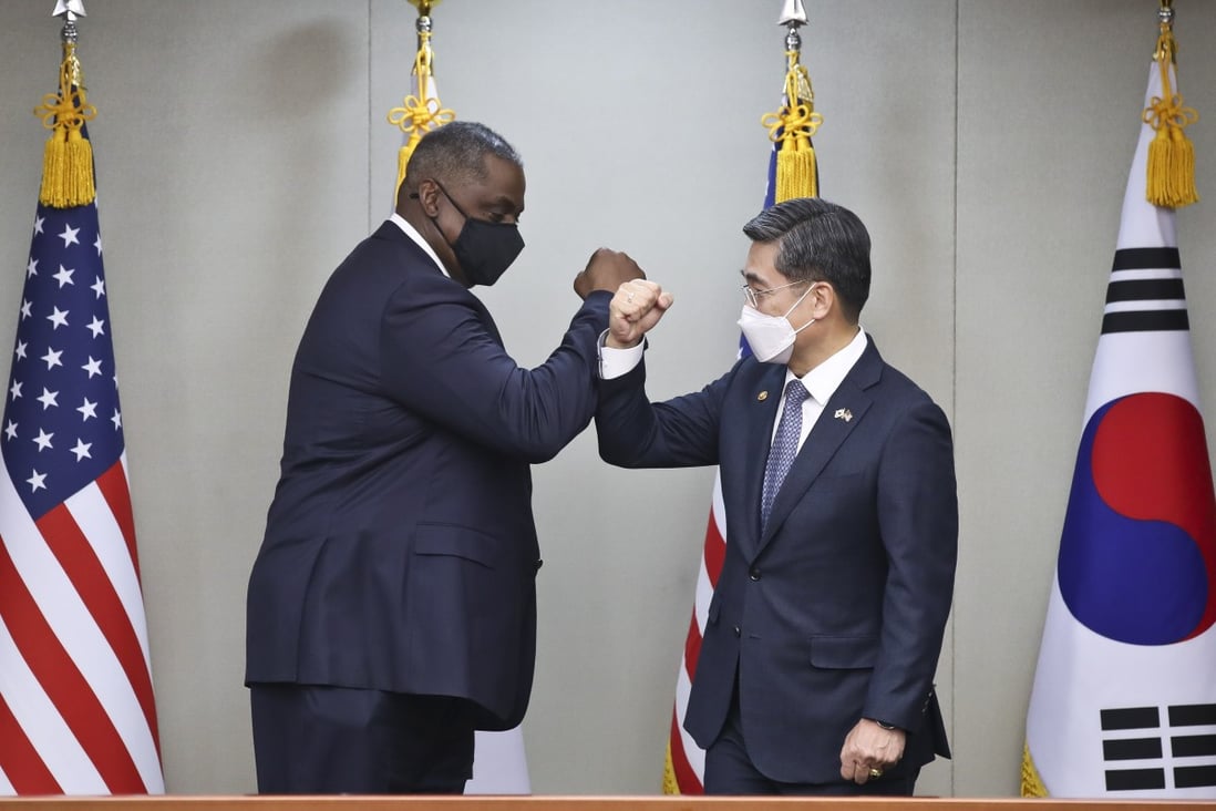 US Secretary of Defence Lloyd Austin (left) bumps fists with his South Korean counterpart Suh Wook before their meeting in Seoul. Photo: EPA