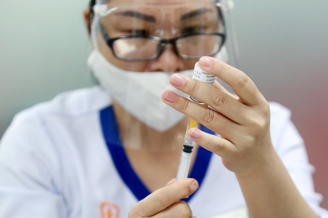 A health worker prepares a shot of the AstraZeneca Covid-19 vaccine in Hanoi, Vietnam. Photo: EPA-EFE