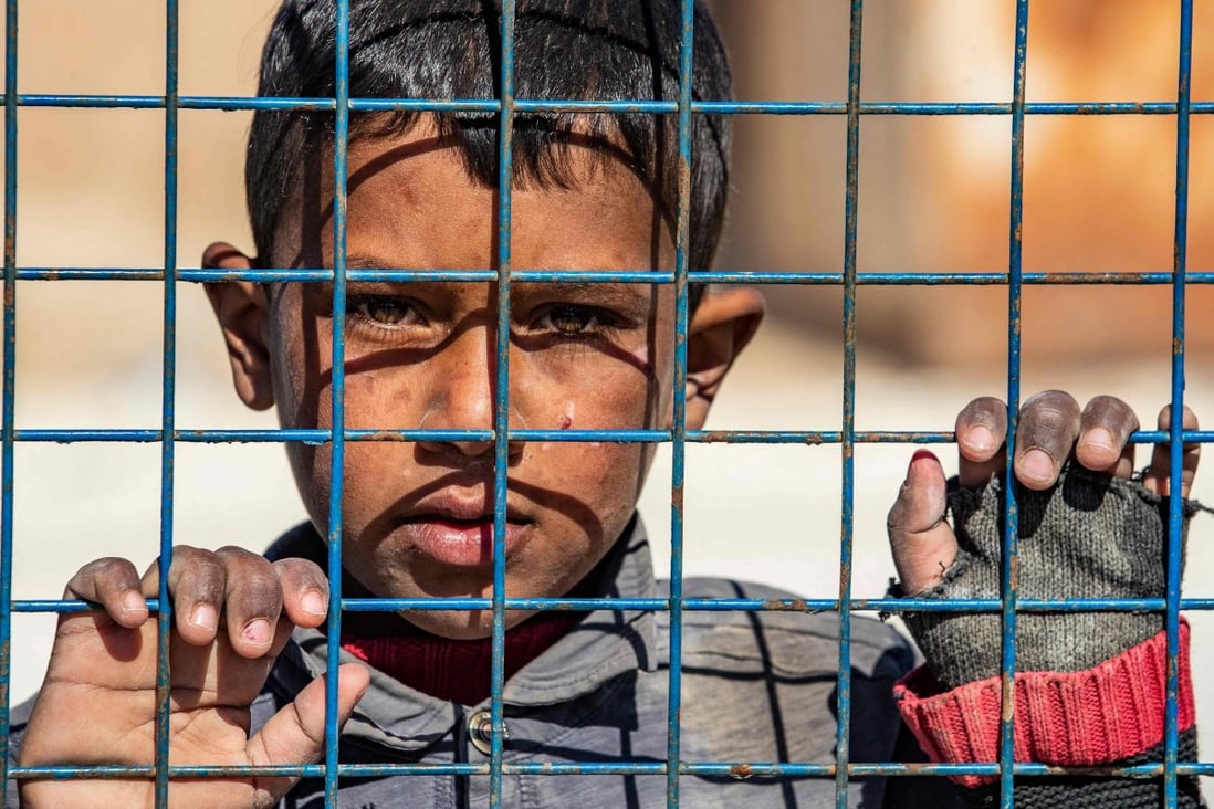A boy awaits departure during the release of a group of Syrian families in Hasakeh governorate. The diversion of resources amid the Covid-19 pandemic would seem to bode poorly for an end to the misery for Syria’s 23 million people. Photo: AFP