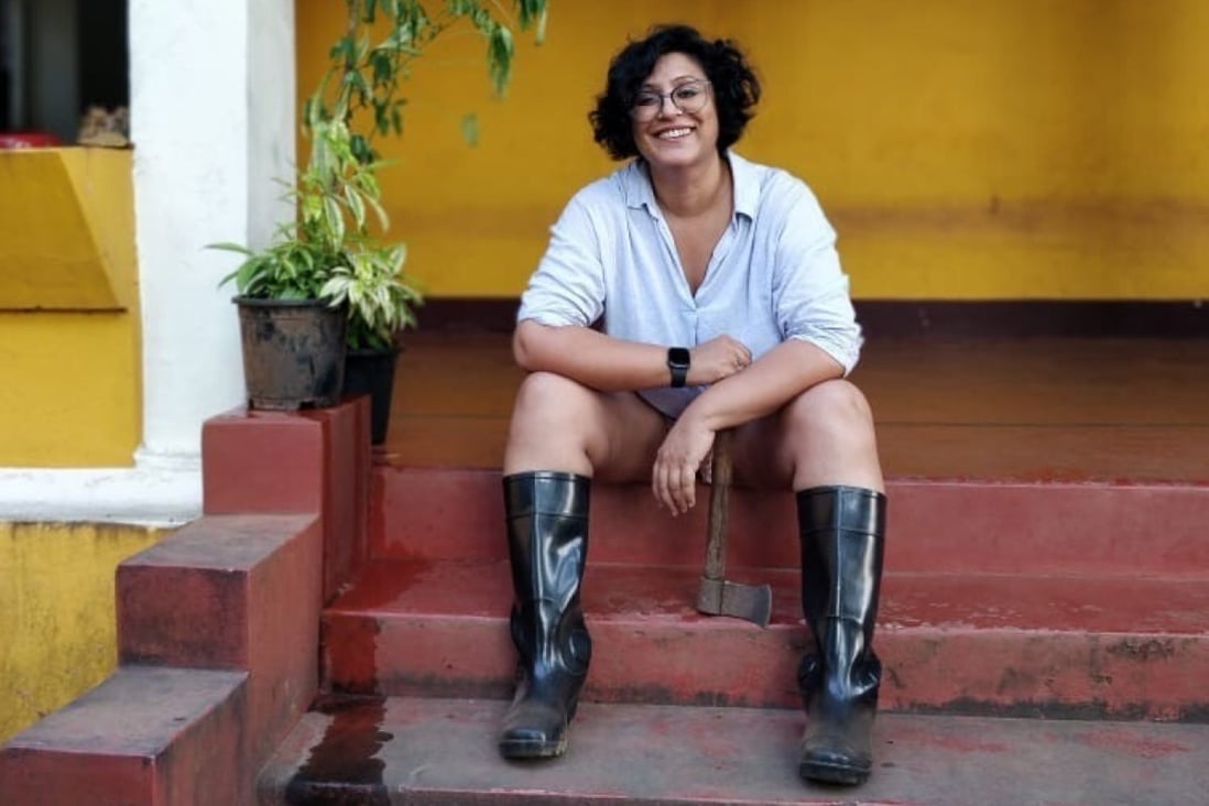 Ruchira Bose, who left Mumbai for Goa last year, sits on the steps of her new home. Photo: Suranjana Ghosh