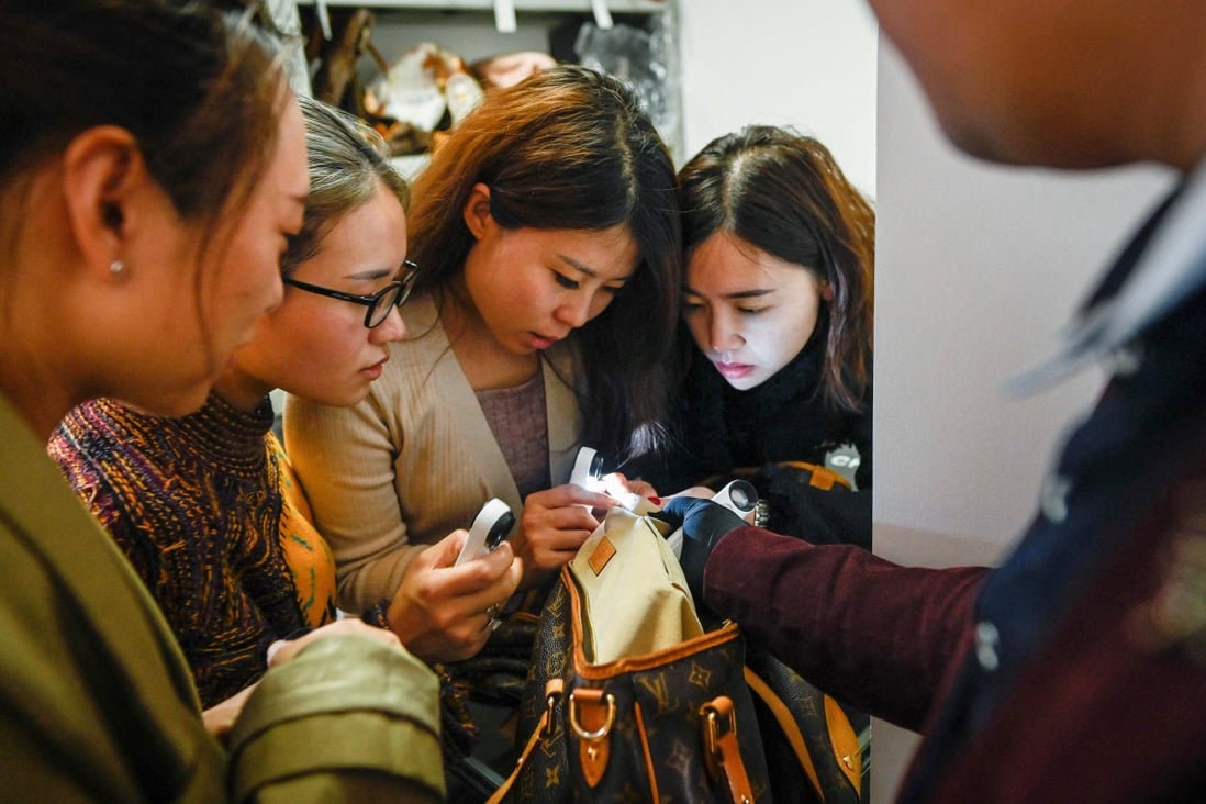 Students in Beijing pay about US$2,400 to learn how to spot real luxury goods from fakes. Photo: AFP