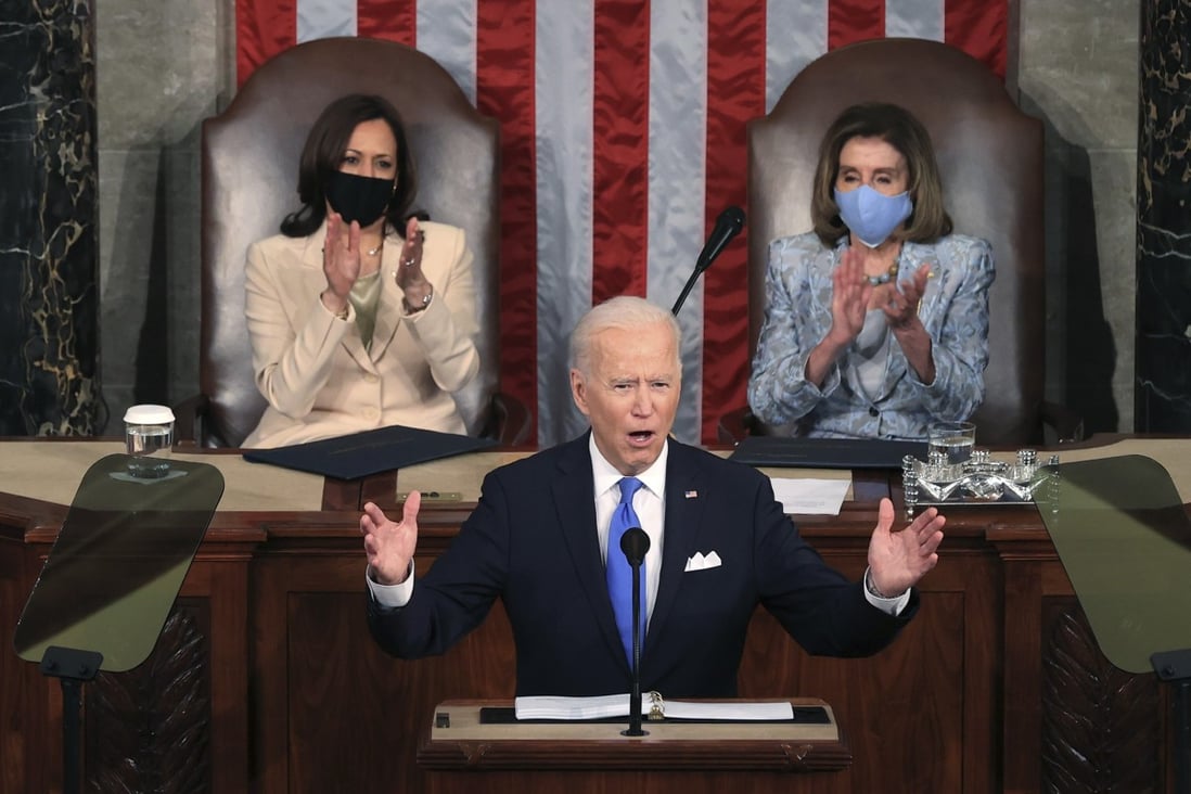 President Joe Biden addresses a joint session of the US Congress on April 28, one day shy of his 100th day in office, as Vice-President Kamala Harris (left) and House Speaker Nancy Pelosi look on. Photo: AP