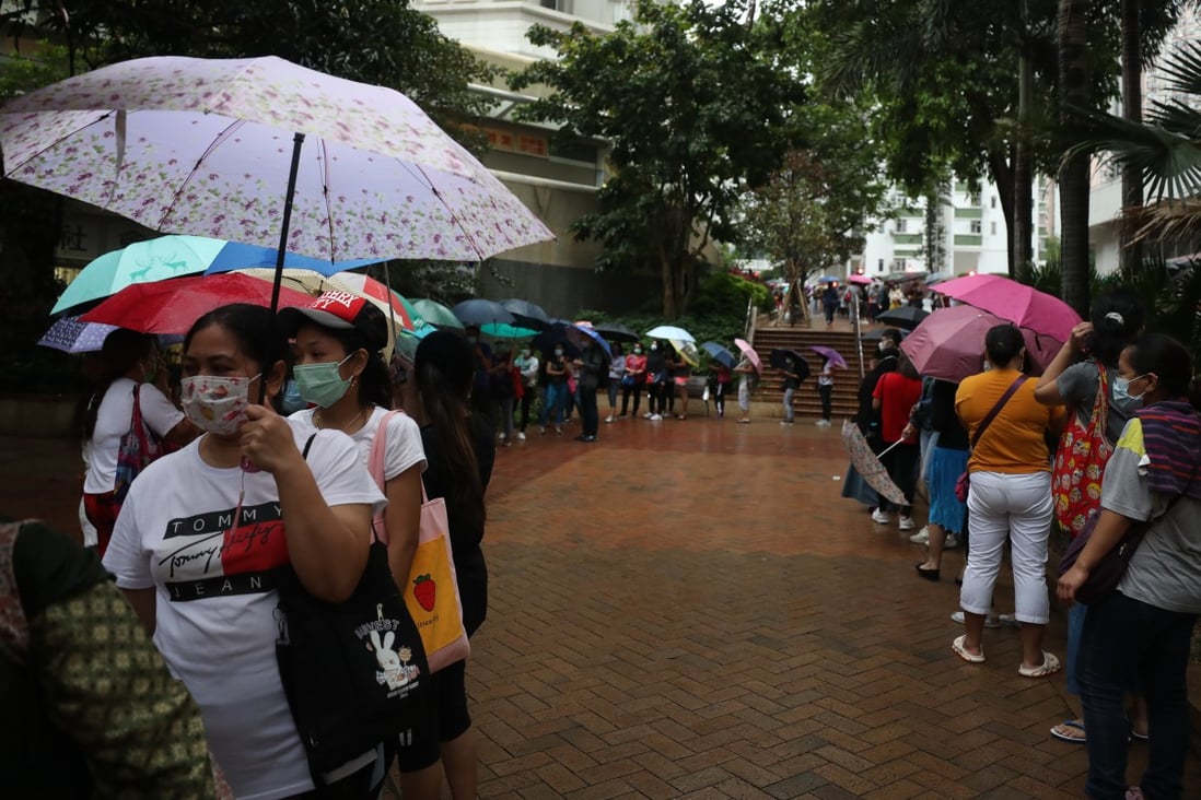 Hong Kong’s foreign domestic helpers queue up for Covid-19 tests outside Quarry Bay Community Hall on May 3. Photo: Xiaomei Chen
