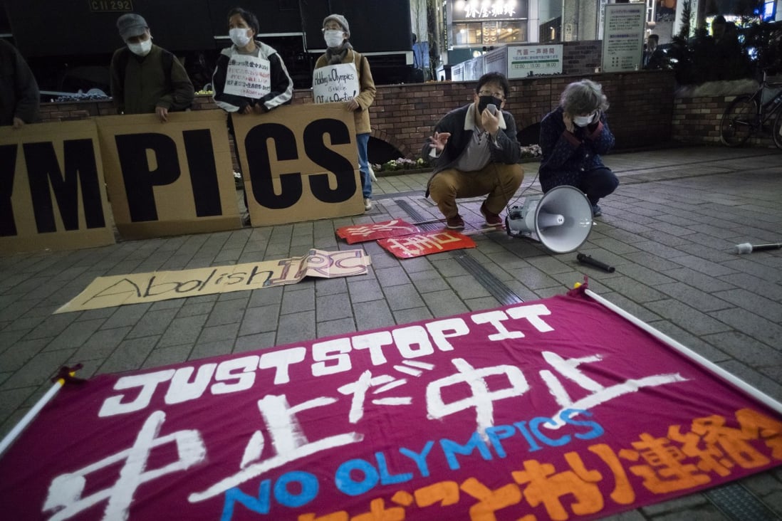 Protesters with a ‘No Olympics’ banner in Tokyo during a demonstration against the Tokyo Games. Photo: AP