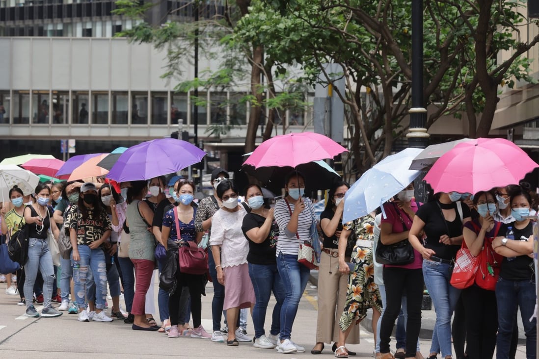 Helpers queue up to be tested for Covid-19 on Chater Road in Central on May 2. Photo: May Tse